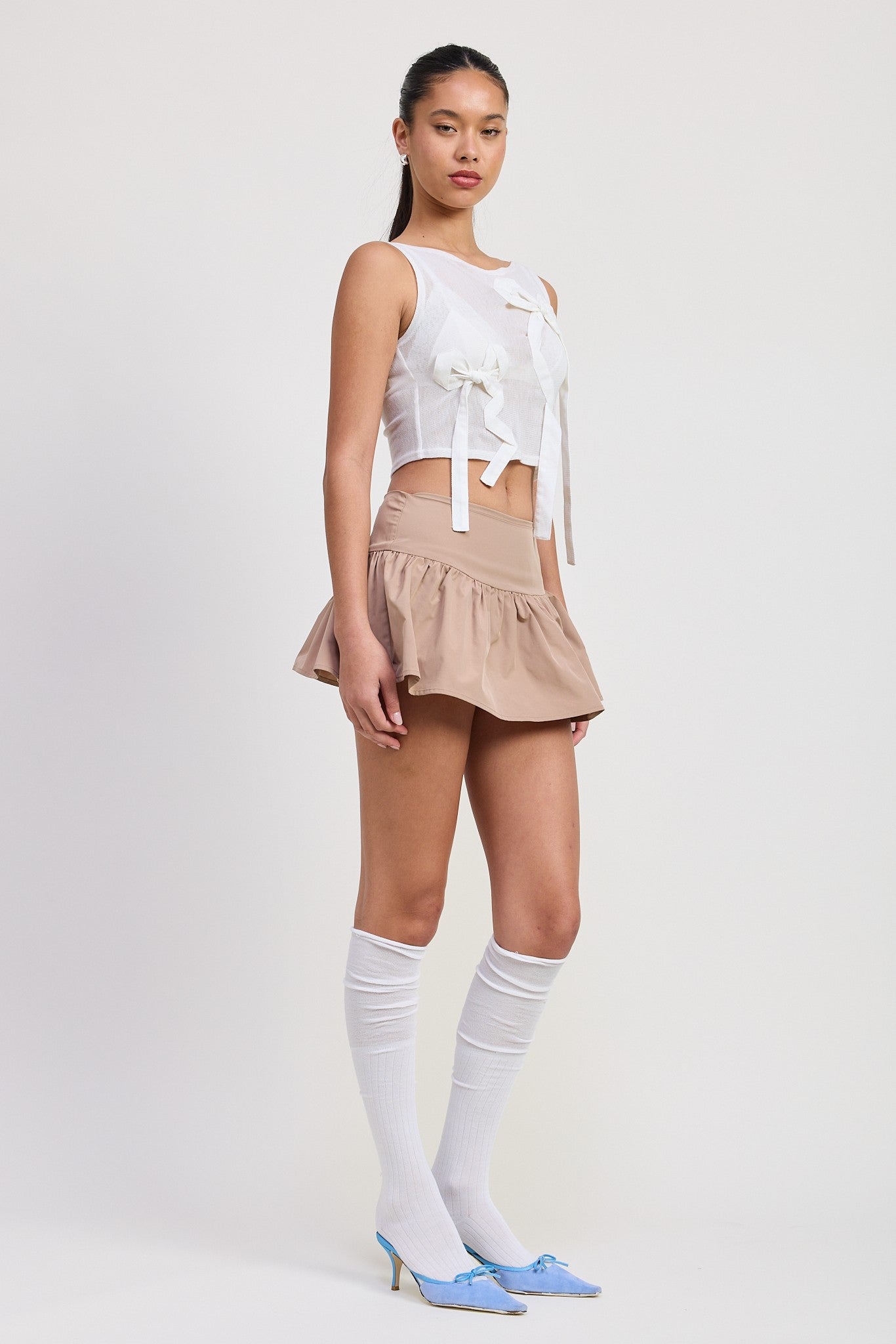SLEEVELESS SHEER BOW TOP